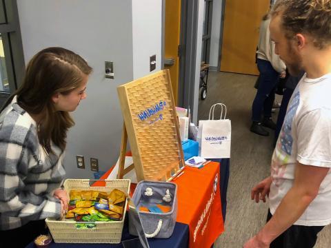 Sexual Well-Being Intern and Student playing plinko